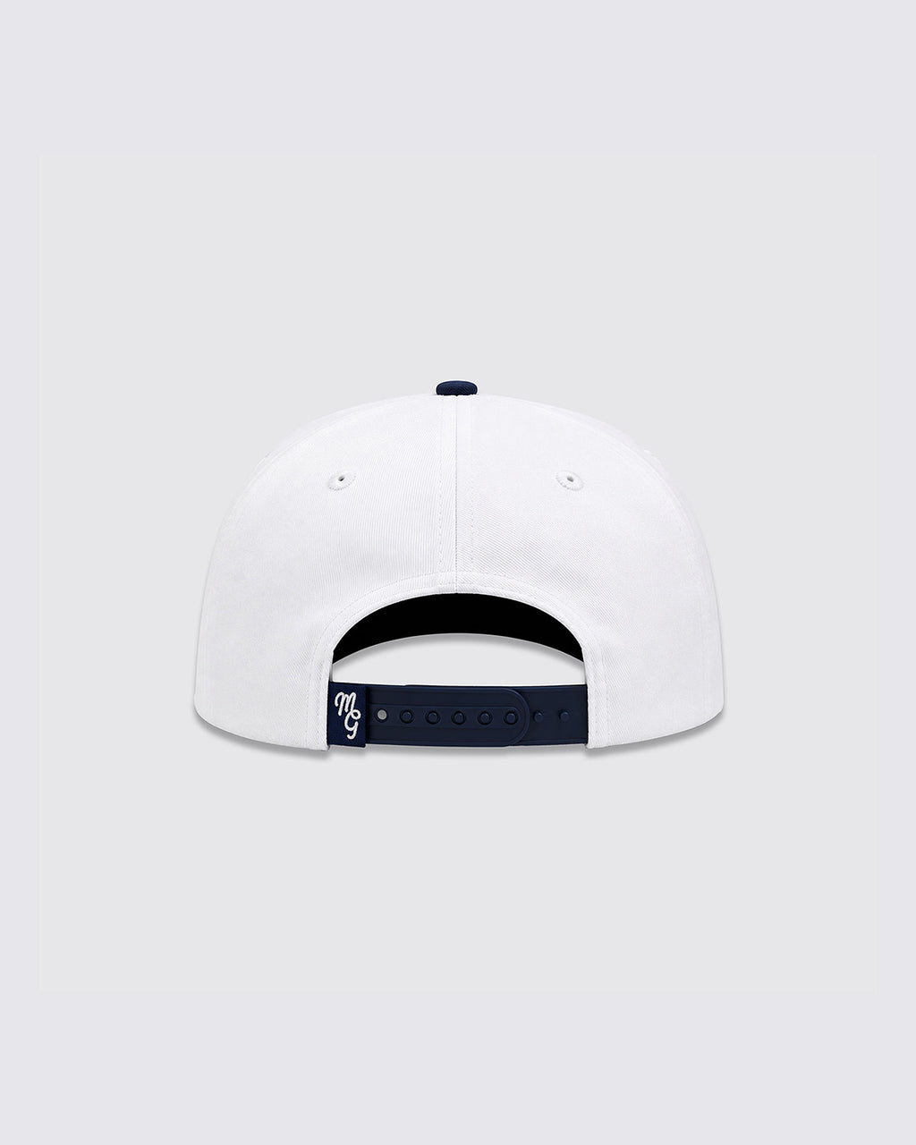 White baseball cap shown from the back, featuring a navy blue adjustable strap with a small white embroidered logo and a navy blue button on top.
