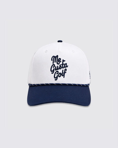 A structured baseball cap with a white crown and a navy blue curved brim. The front of the crown features the text 'Me Gusta Golf' embroidered in dark navy blue script.